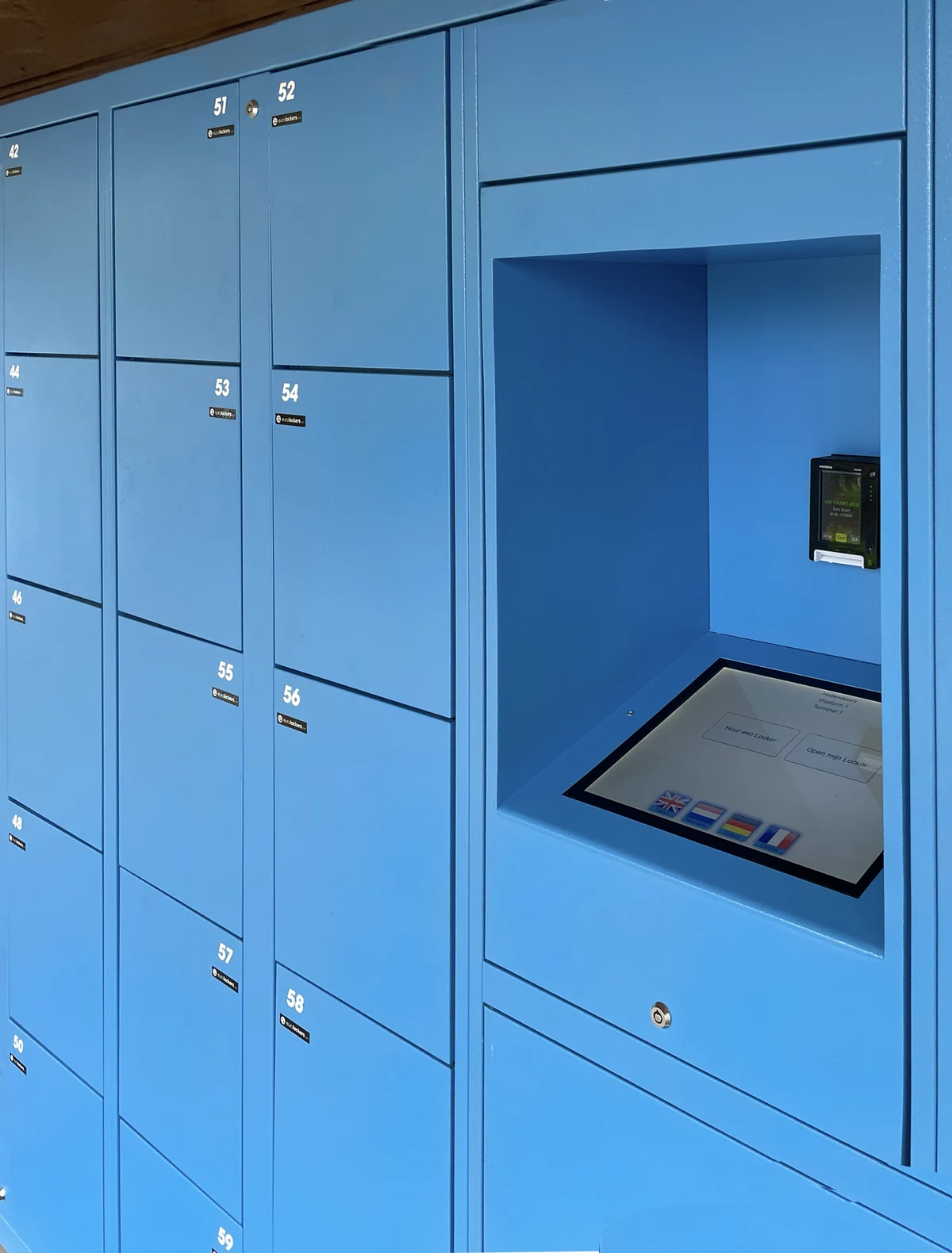Blue lockers with an integrated touchscreen and card payment terminal